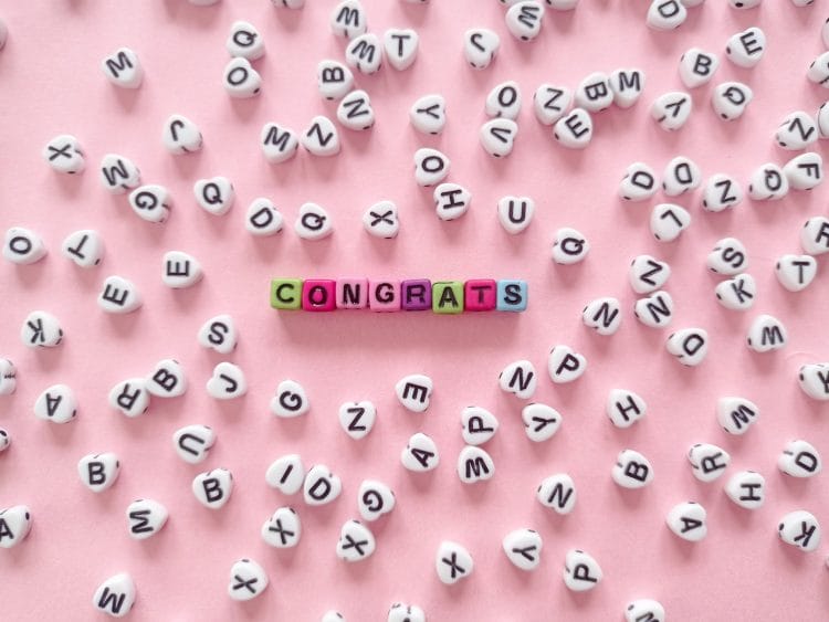 congrats text on a pink surface